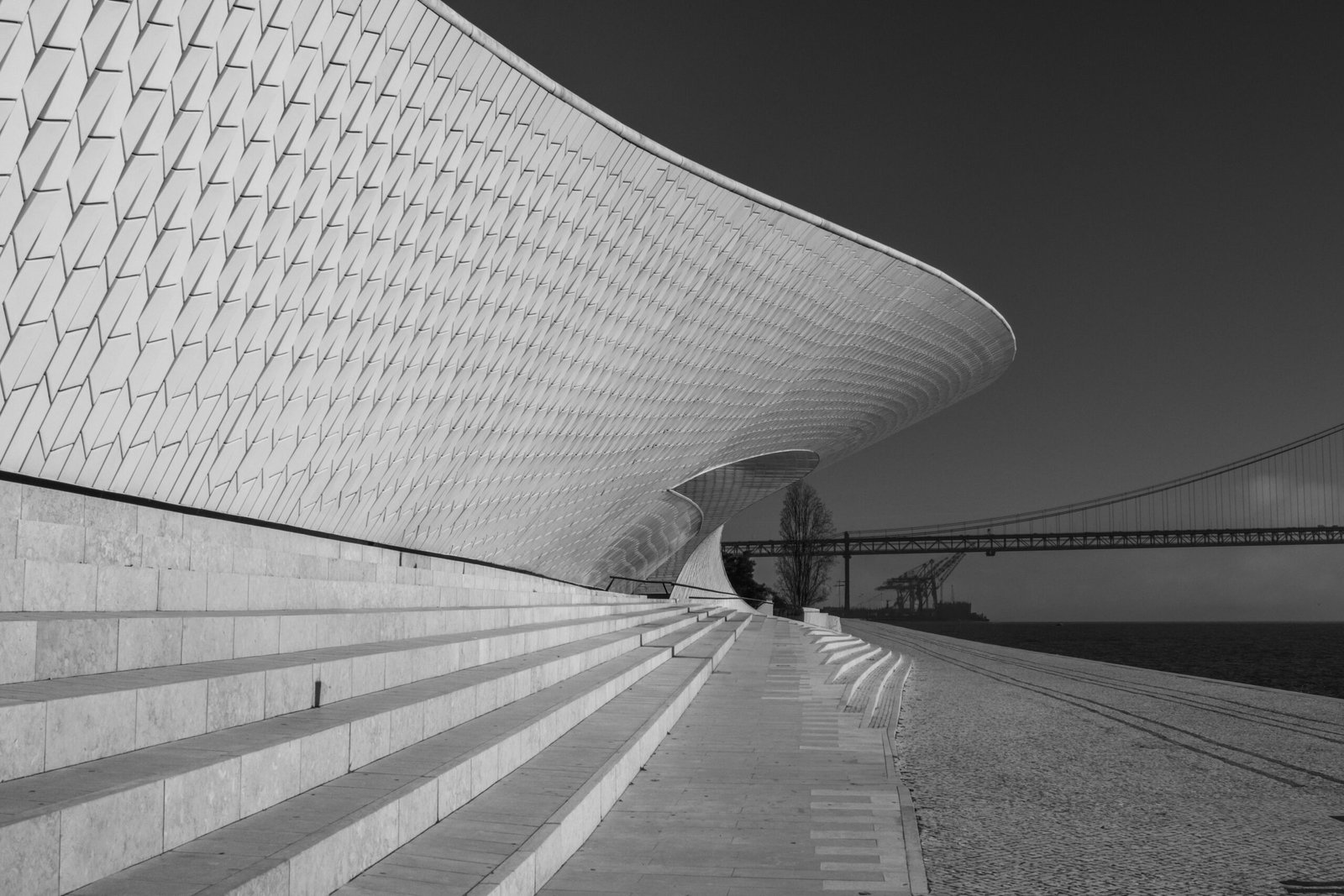 A neuro-inclusive corporate event lounge in Lisbon 2026 featuring sound-dampened sensory pods and biophilic design for delegate wellness.